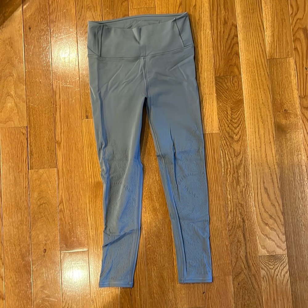 New!  Lululemon leggings.  Gray with mesh details.  Size 8